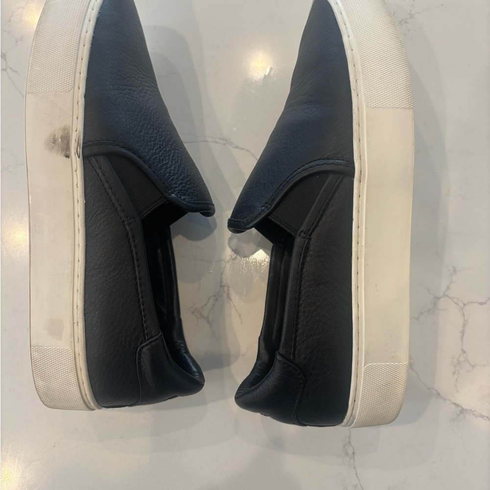 Women’s Ugg black platform slip on size 9